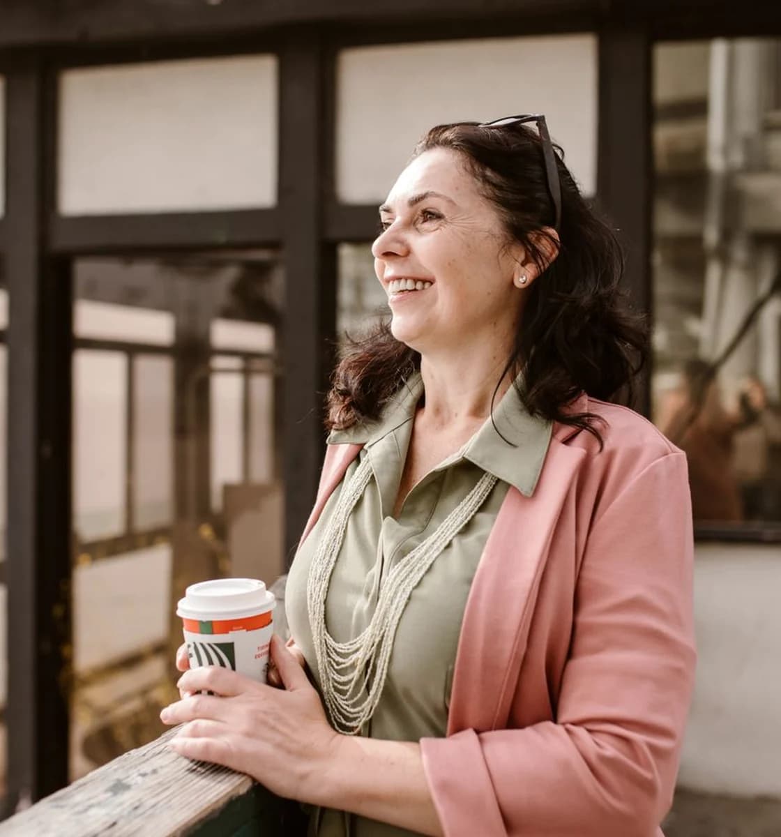 Adult woman smiling reassuringly in a contemporary European setting